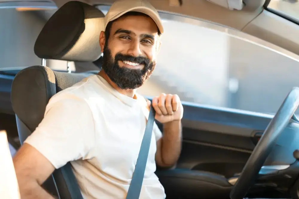 A verified CabsPune driver at the wheel of a cab in Pune